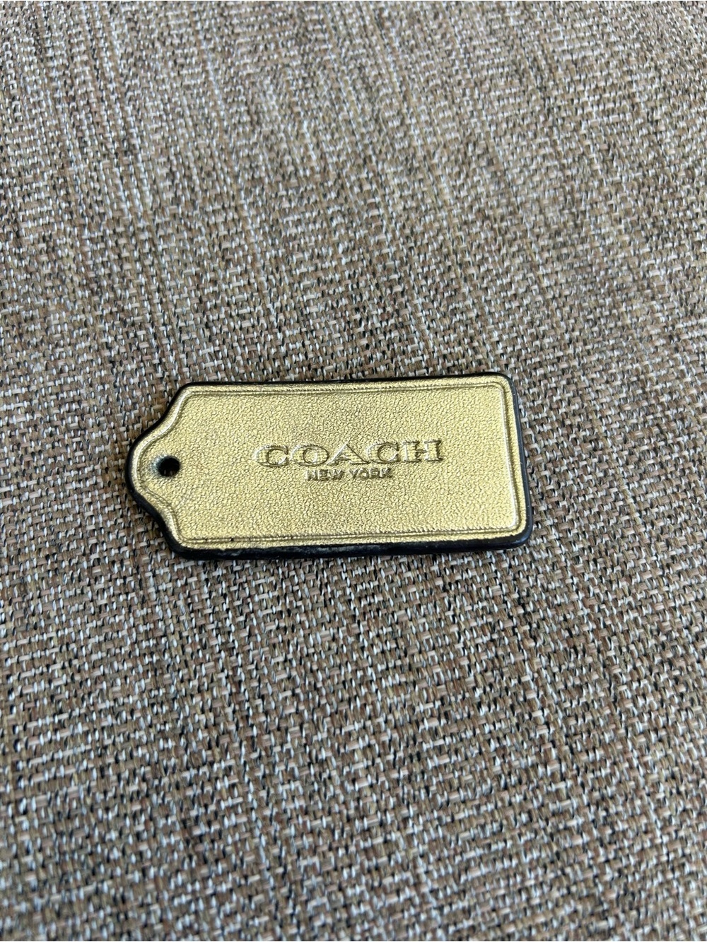 Coach gold tag